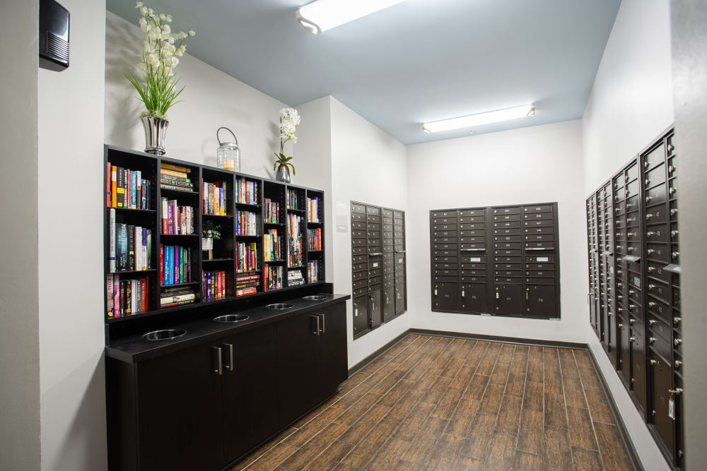 Package and mail area with books to read at Olympus Midtown in Nashville, Tennessee