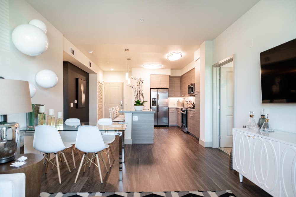 Modern furnishings in the open-concept living area of a model apartment at Fusion Apartments in Irvine, California