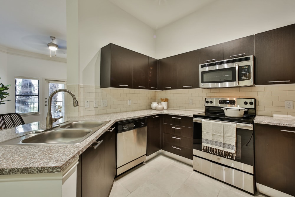 Kitchen in model apartment home at Broadstone Toscano in Houston, Texas
