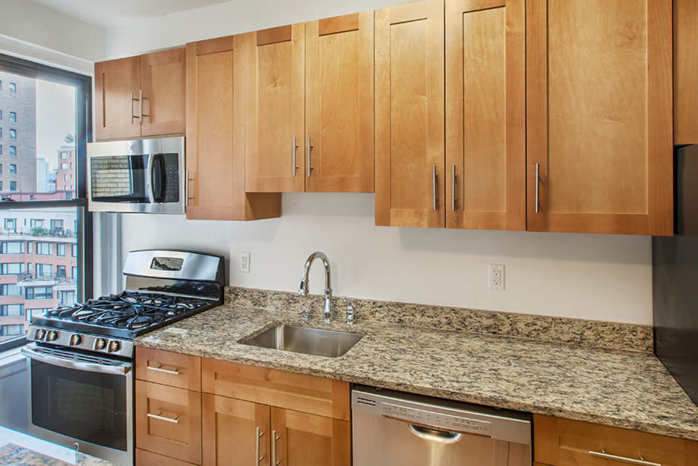 Kitchen with granite counter tops at The Sutton Collection in New York, New York