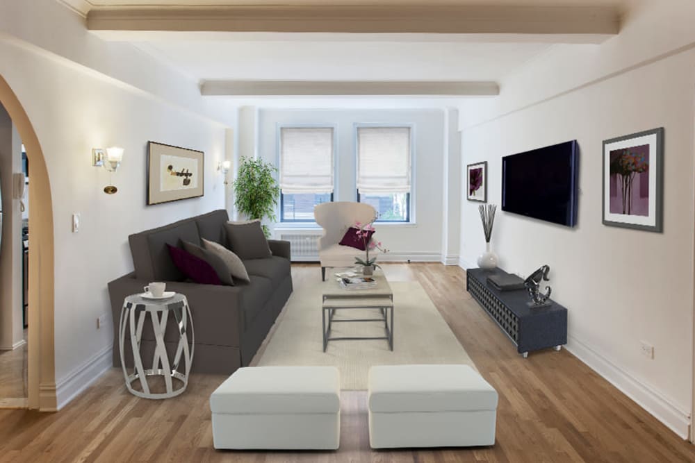 Spacious living room with wood-style flooring at The Sutton Collection in New York, New York