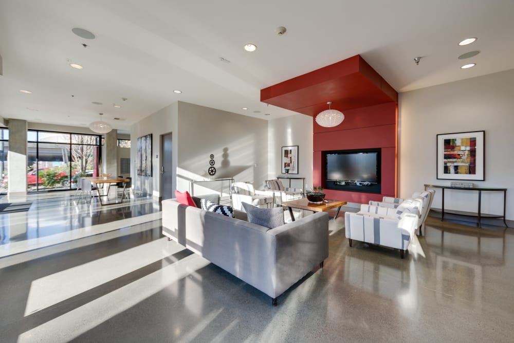 Indoor community lounge with a TV at Milano in Portland, Oregon