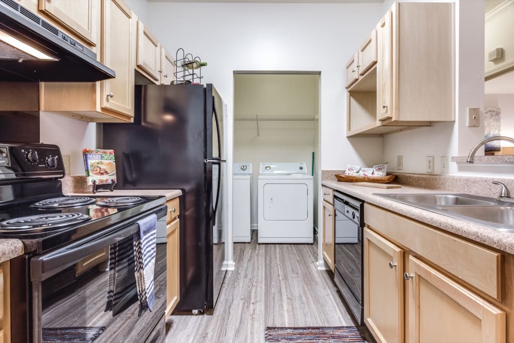 A kitchen with new appliances at The Enclave at Deep River in Greensboro, North Carolina