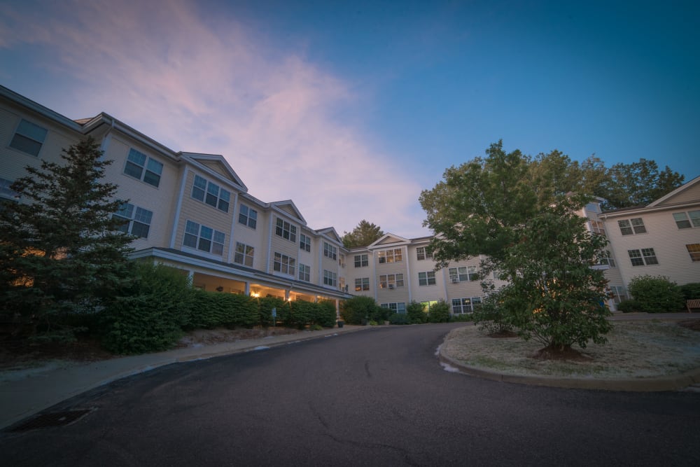 The exterior of Harbor Village Senior Communities at dusk in South Burlington, Vermont