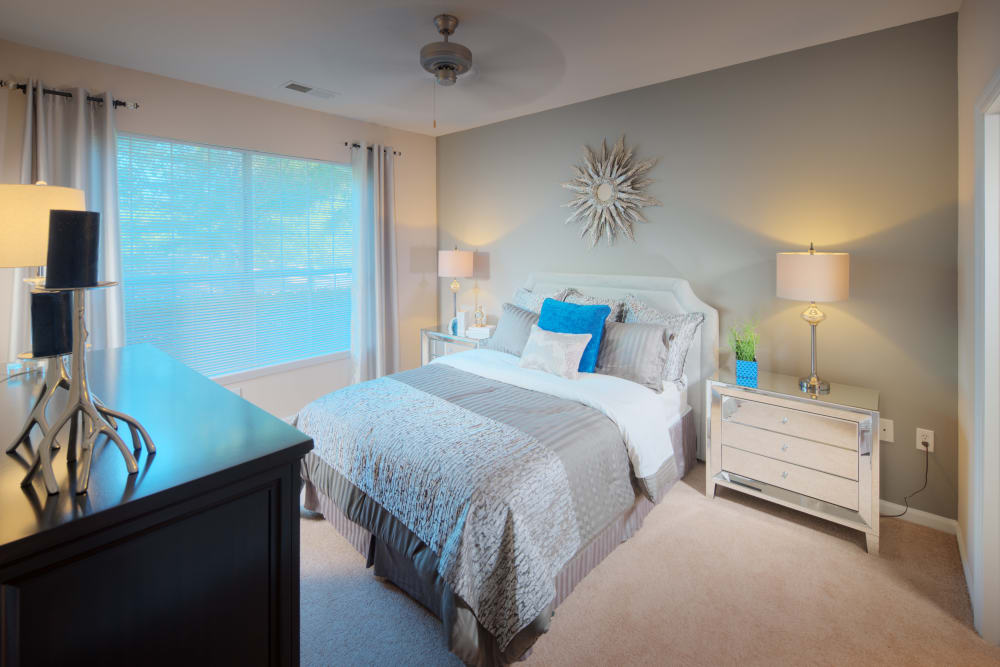 Large bedroom with blue accents at Preston View in Morrisville, North Carolina