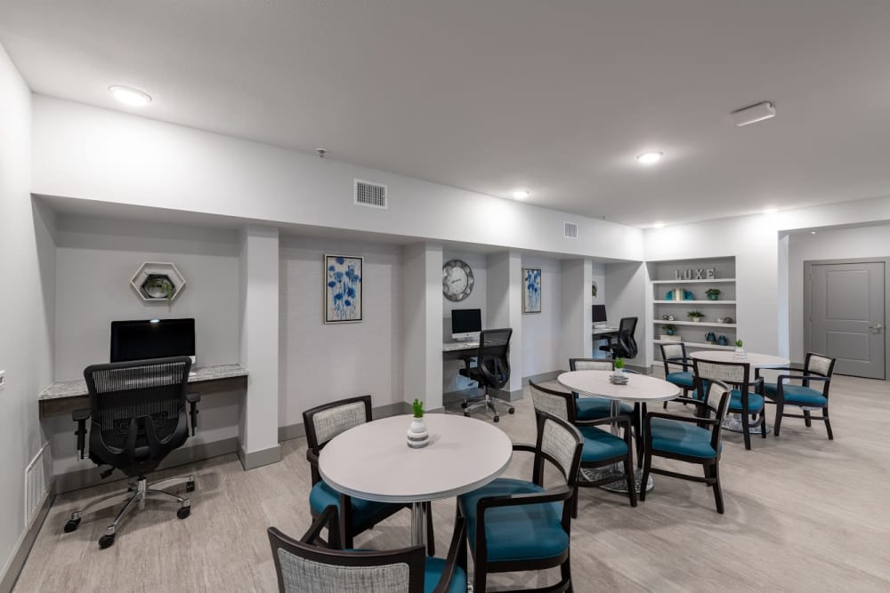 Activity room with computers for residents at The Luxe at Cedar Hill in Cedar Hill, Texas