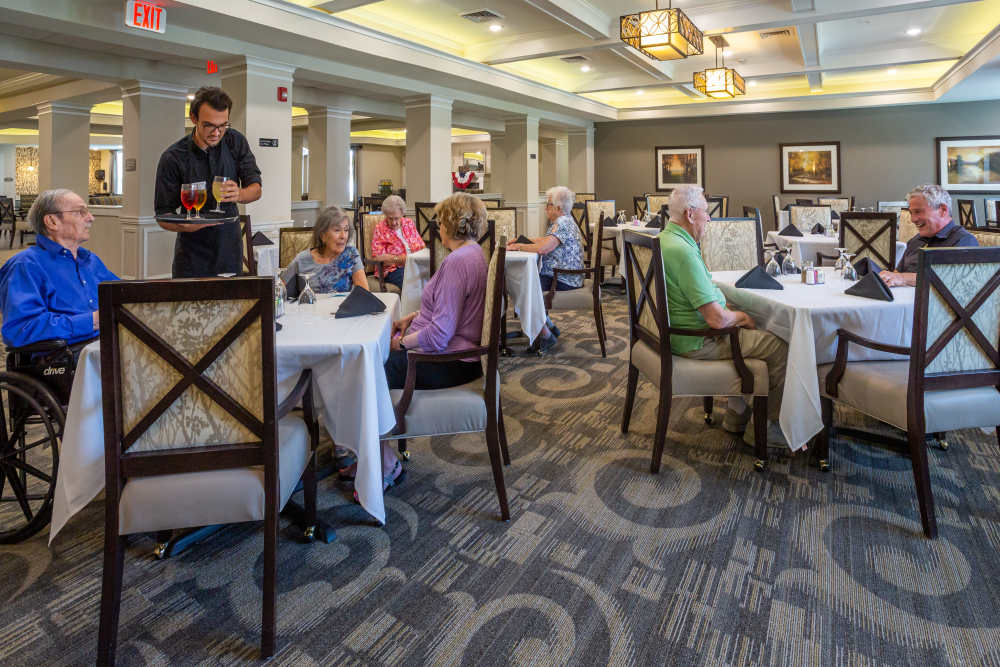 Residents having a meal in the bistro at Harmony at Five Forks in Simpsonville, South Carolina