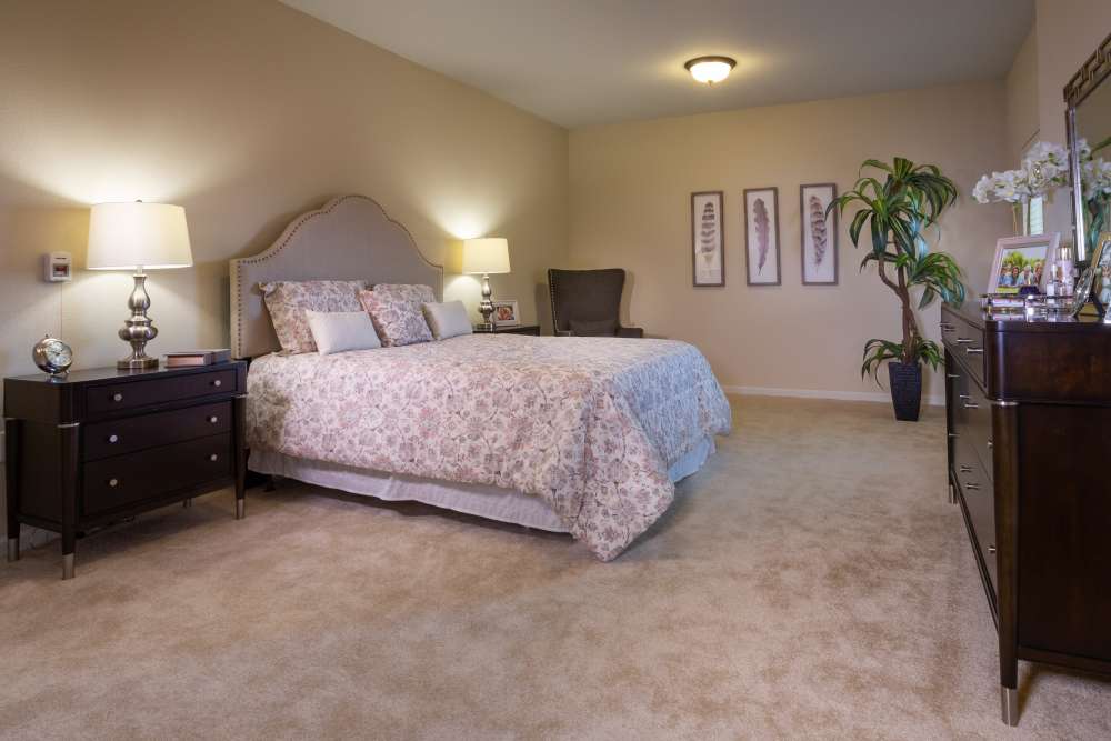 Bedroom with side lamps at Harmony at Five Forks in Simpsonville, South Carolina
