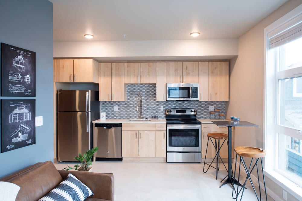Bright and modern kitchen in an open-concept model home at Brooklyn Yard in Portland, Oregon