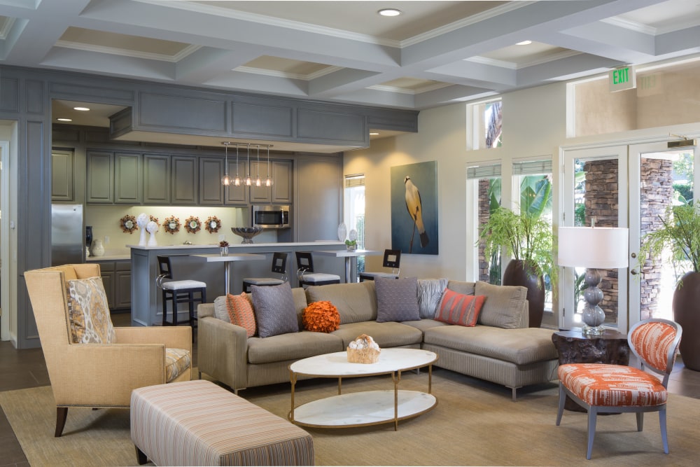 Clubhouse with plenty of comfortable seating at Alicante Apartment Homes in Aliso Viejo, California