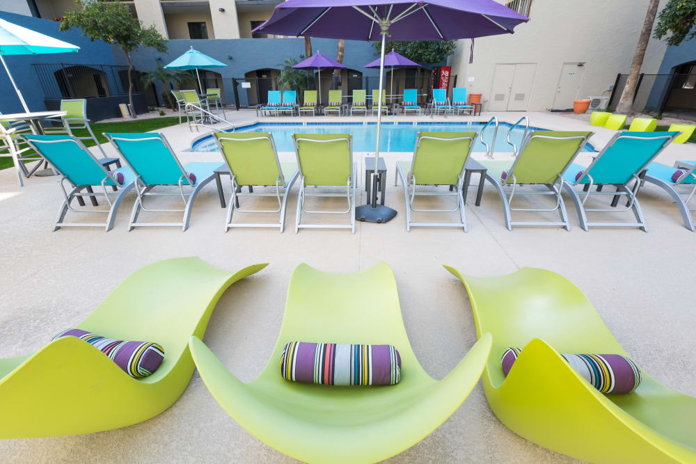 Brightly colored lounge chairs outside pool at 4127 Arcadia in Phoenix, Arizona