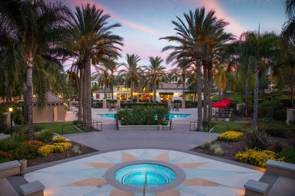 Beautiful outdoor area with hot tub at dawn at Esplanade Apartment Homes in Riverside, California