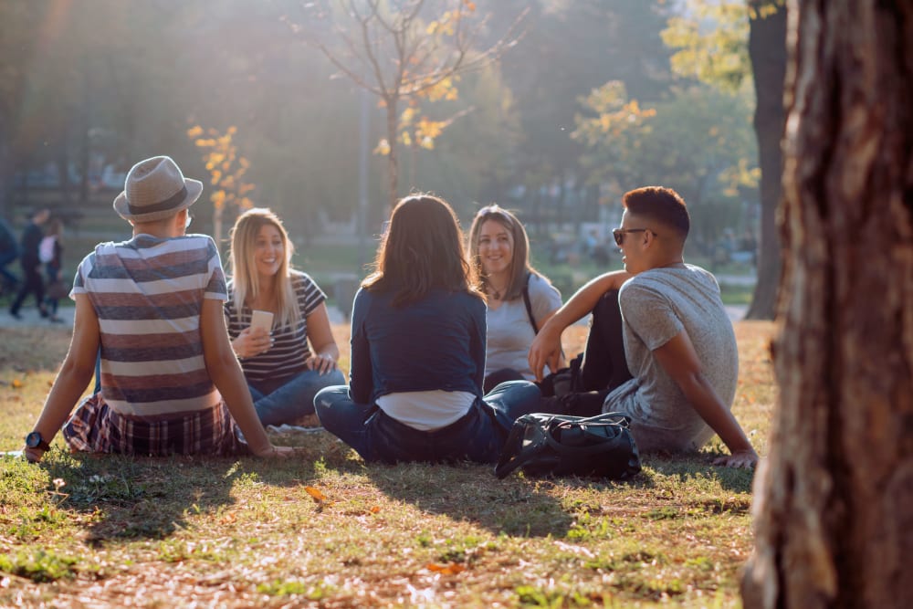 Friends having a picnic in Fort Collins, Colorado near UNCOMMON Fort Collins