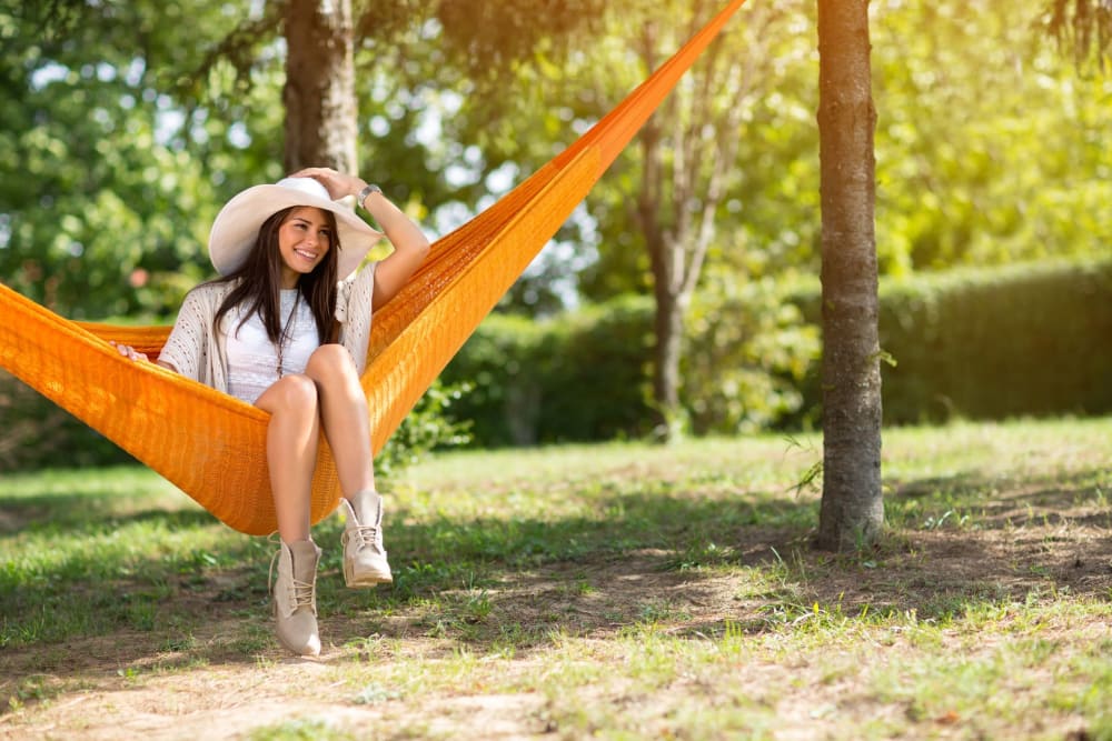 Resident sitting on a hammock near UNCOMMON Oxford in Oxford, Mississippi
