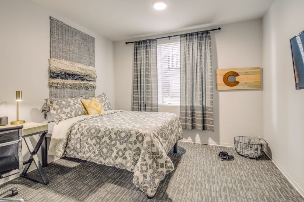 Spacious bedroom with a place to study at UNCOMMON Fort Collins in Fort Collins, Colorado