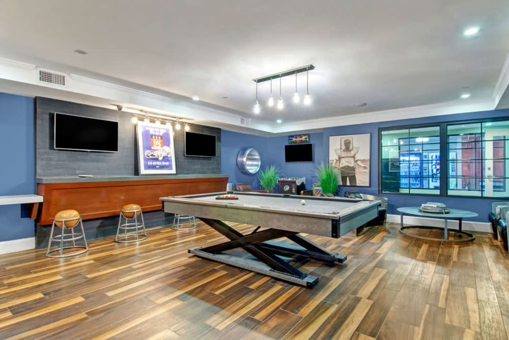 Billiards table in Clubhouse featuring Hardwood floors at Bradlee Danvers in Danvers, Massachusetts