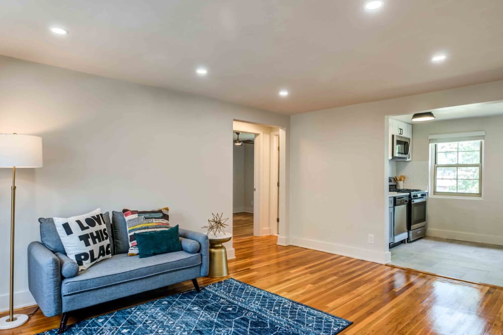 Spacious living room with hardwood floors at Haven New Providence in New Providence, New Jersey