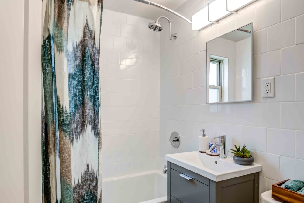 Bathroom with shower bathtub at Haven New Providence in New Providence, New Jersey