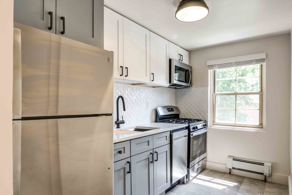 Stainless steel appliances are featured in this kitchen at Haven New Providence in New Providence, New Jersey