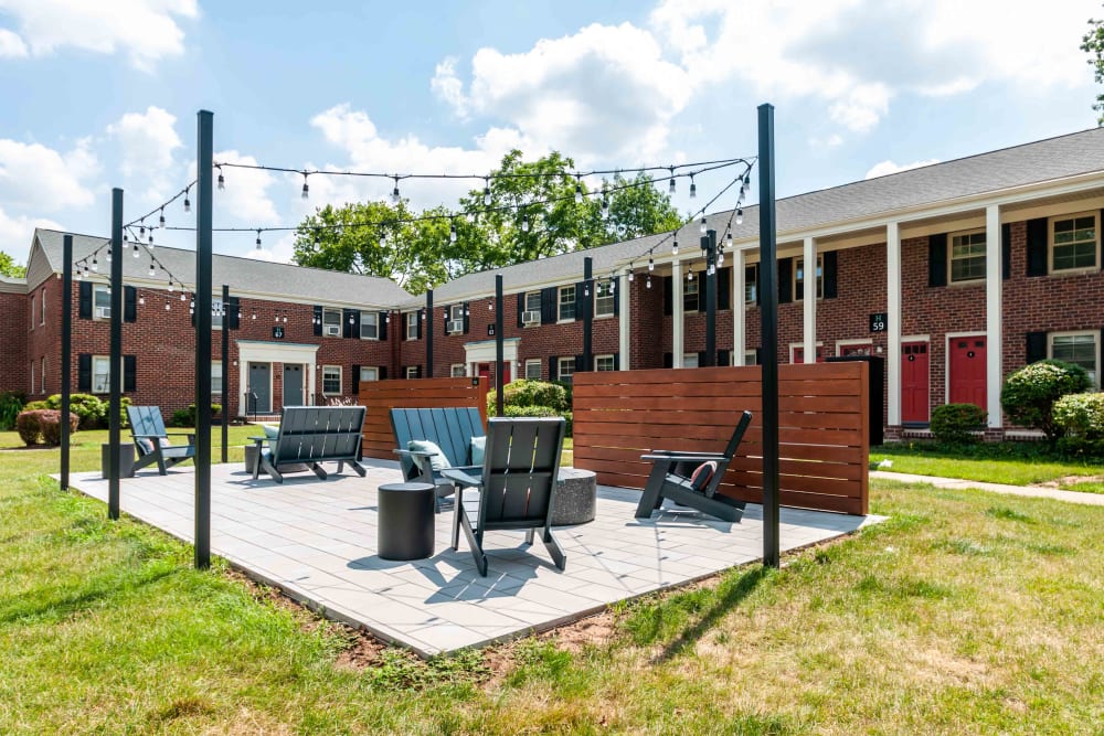 Outdoor sitting area at Haven New Providence in New Providence, New Jersey has string lights for night time enjoyment