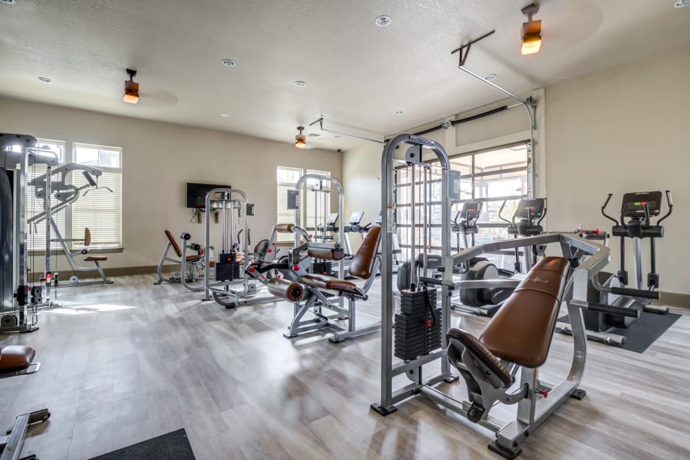 Fitness center with individual workout stations at The Addison at South Tryon in Charlotte, North Carolina