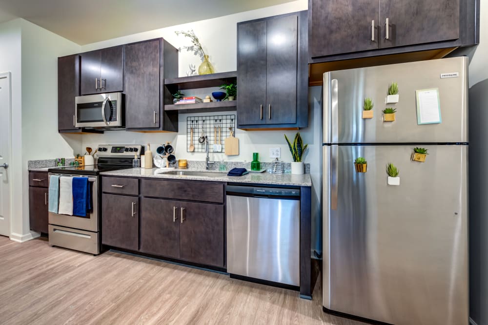 Kitchen with stainless steel appliances at LATITUDE at Kent in Kent, Ohio