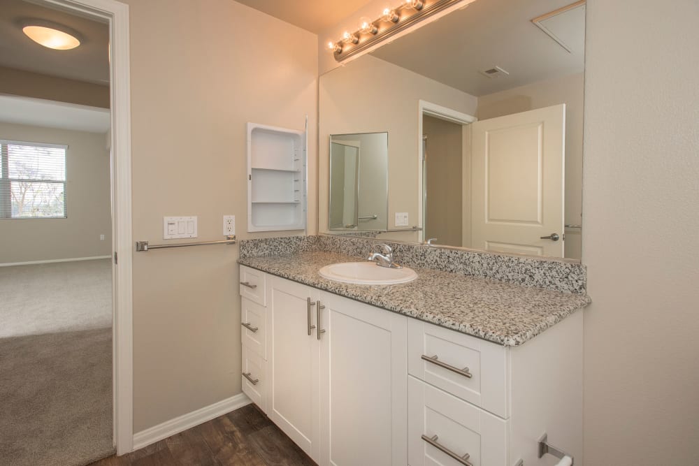 Bathroom with a large vanity mirror and plenty of counter space at Paragon at Old Town in Monrovia, California