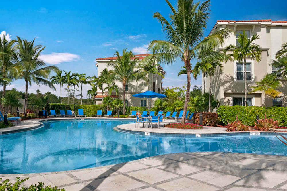 Poolside community space at City Center on 7th Apartment Homes in Pembroke Pines, Florida