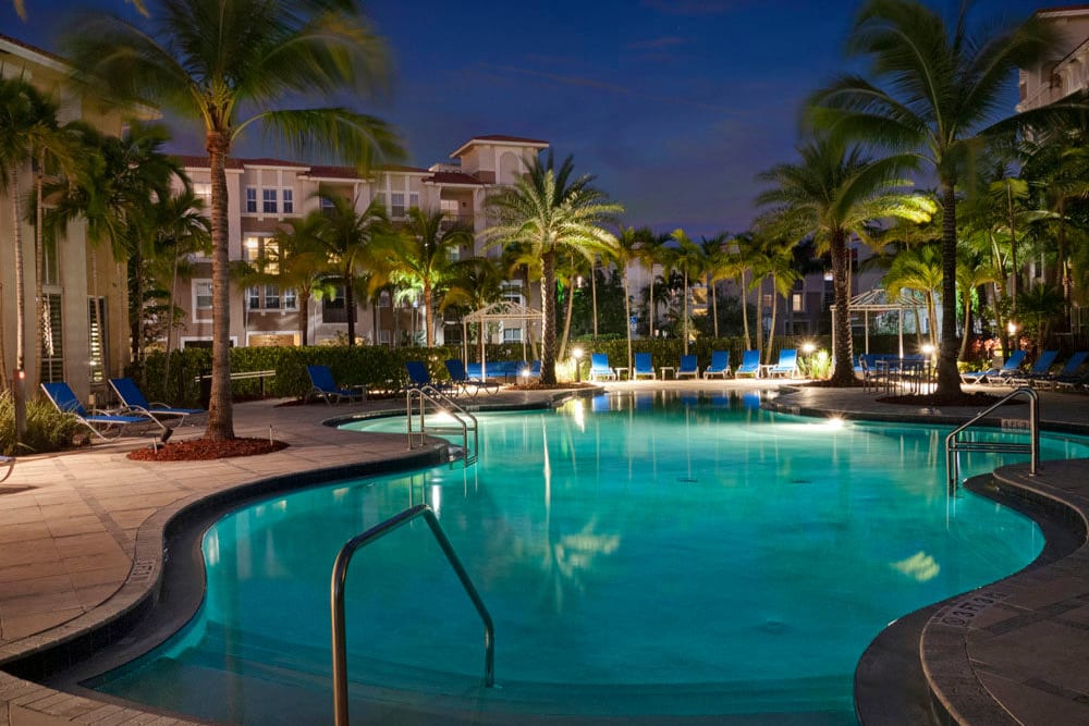 Pool at City Center on 7th Apartment Homes in Pembroke Pines, Florida lit up at night