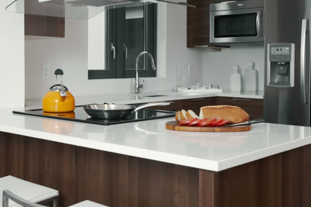 Kitchen with orange accents at Monarch at Ridge Hill in Yonkers, New York