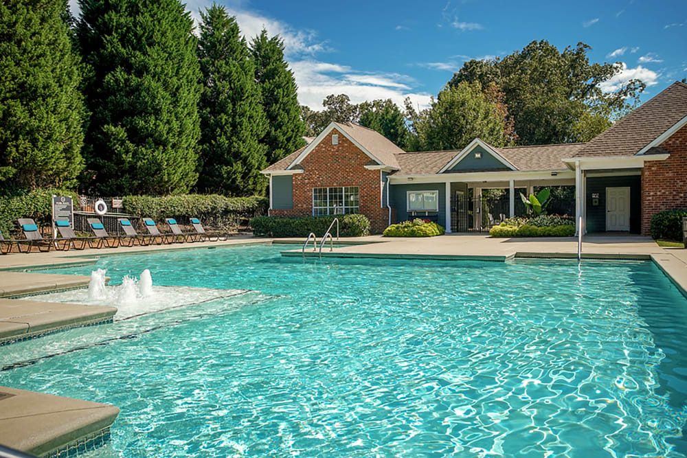 Community swimming pool features a splash fountain area at Eastwood Village in Stockbridge, Georgia