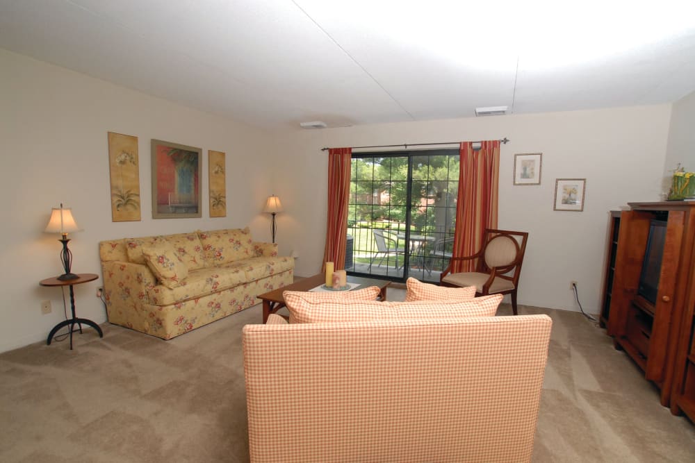 Loveseat and couch in a living room in an apartment at The Heights At Marlborough in Marlborough, Massachusetts