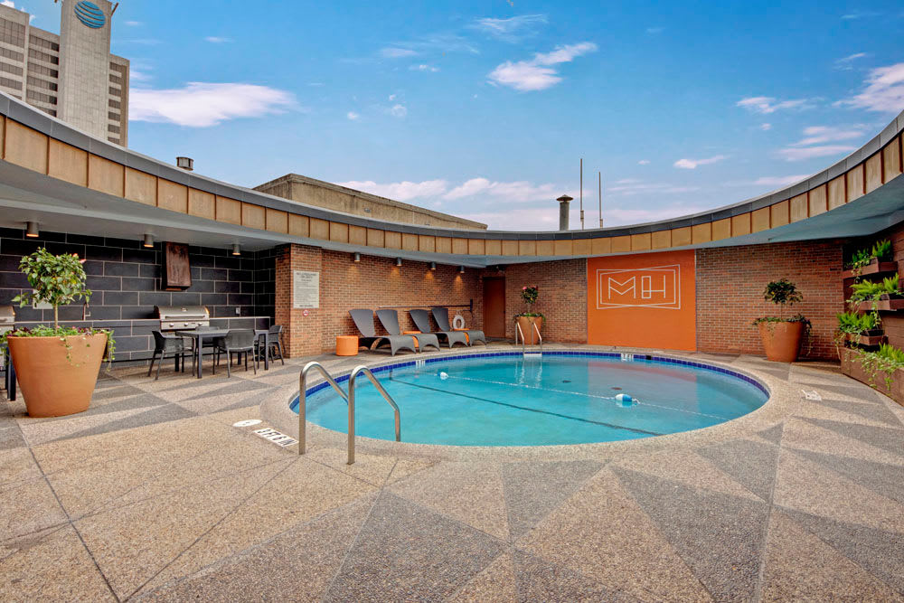 Rooftop pool with skyline view at Manor House in Dallas, Texas