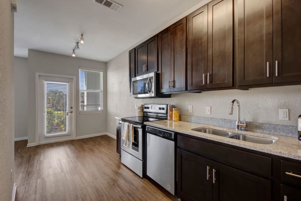 Kitchen featuring stainless steel appliances at Linden on the GreeneWay in Orlando, Florida
