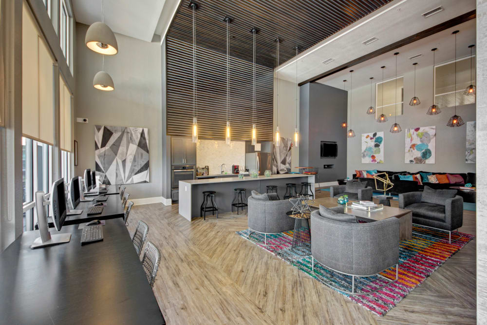 Stylishly decorated clubhouse at Linden on the GreeneWay in Orlando, Florida features tall ceilings and modern furnishings