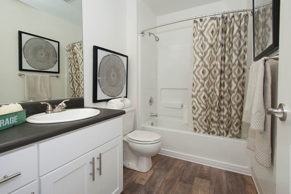 Main bathroom with an oval tub at Sandpiper Village Apartment Homes in Vacaville, California