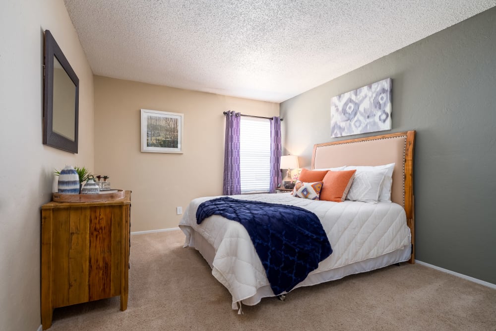 Well lit model bedroom at The Fairway Apartments in Plano, Texas