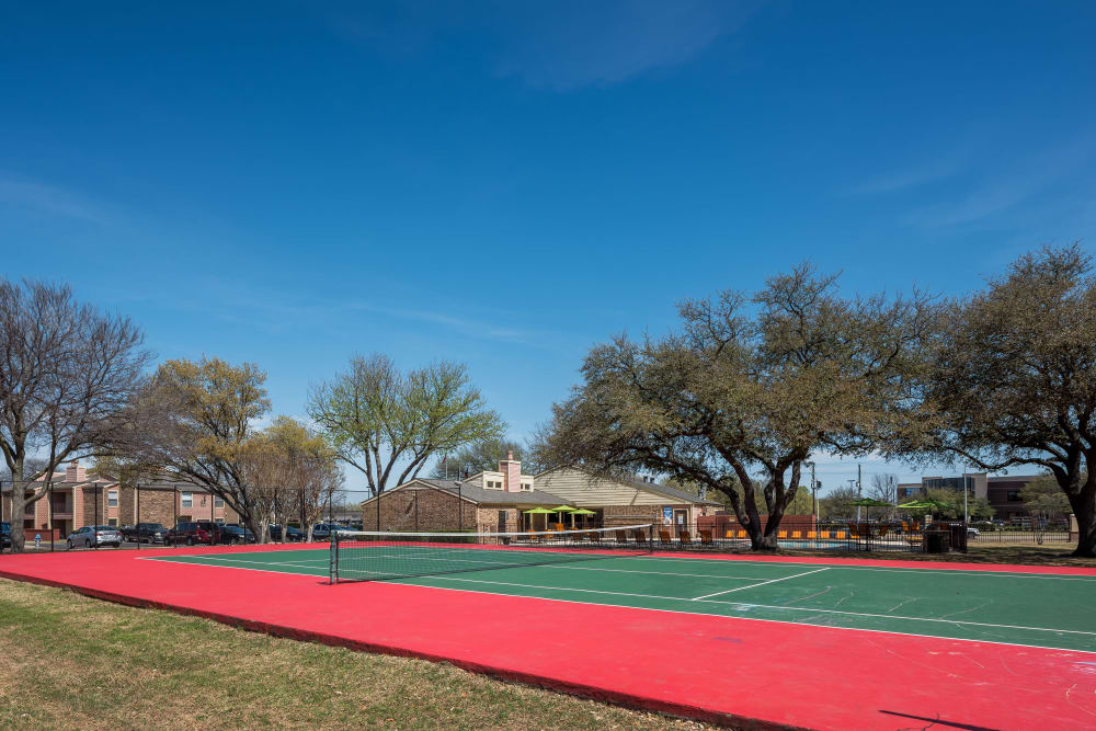 On-site tennis court for residents at The Fairway Apartments in Plano, Texas