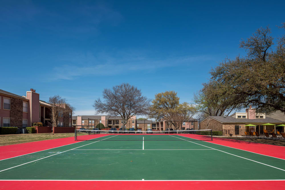 On-site tennis court for residents at The Fairway Apartments in Plano, Texas