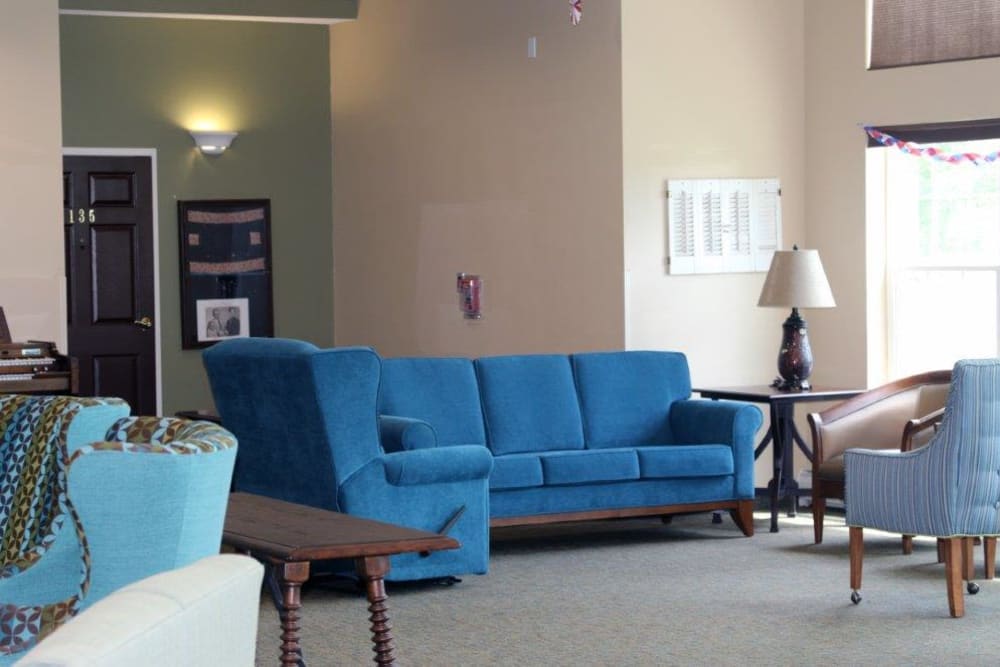 Community lounge with blue furniture at Keelson Harbour in Spirit Lake, Iowa