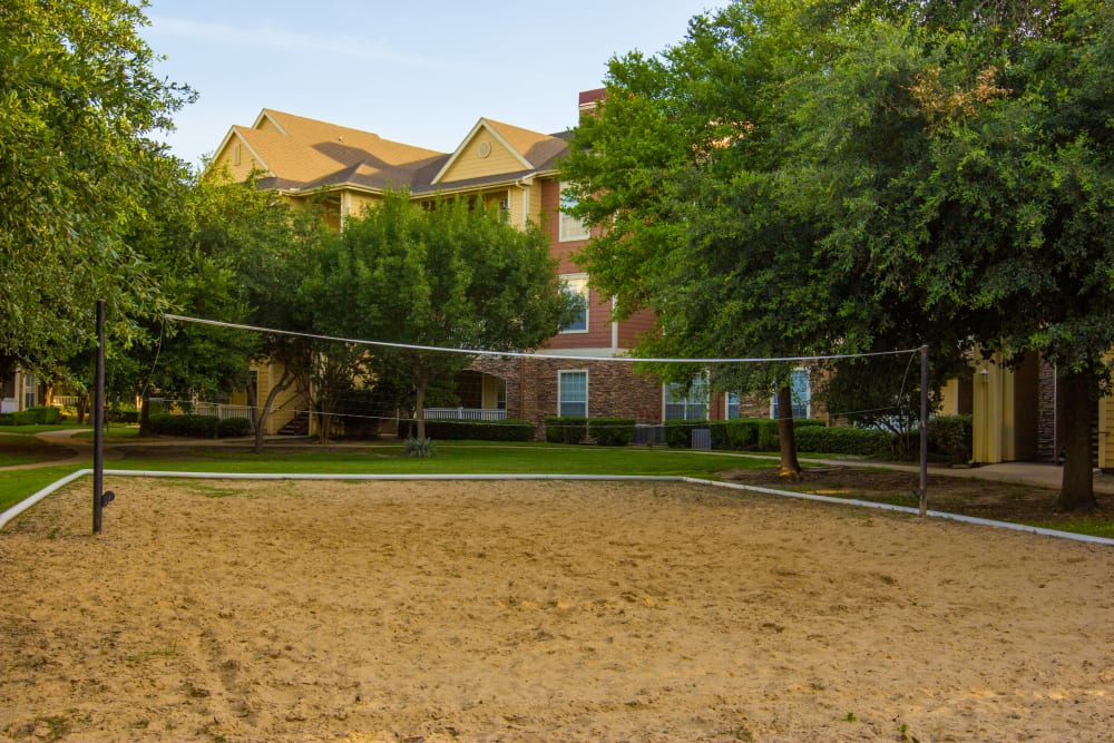 Outdoor volleyball court at The Lodge at River Park in Fort Worth, Texas