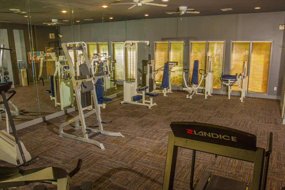 Plenty of individual weight machines in the fitness center at The Lodge at River Park in Fort Worth, Texas