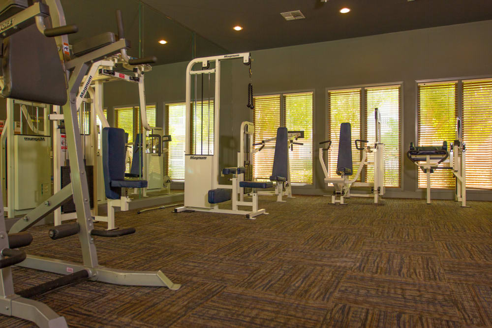 Weight machines in the fitness center at The Lodge at River Park in Fort Worth, Texas