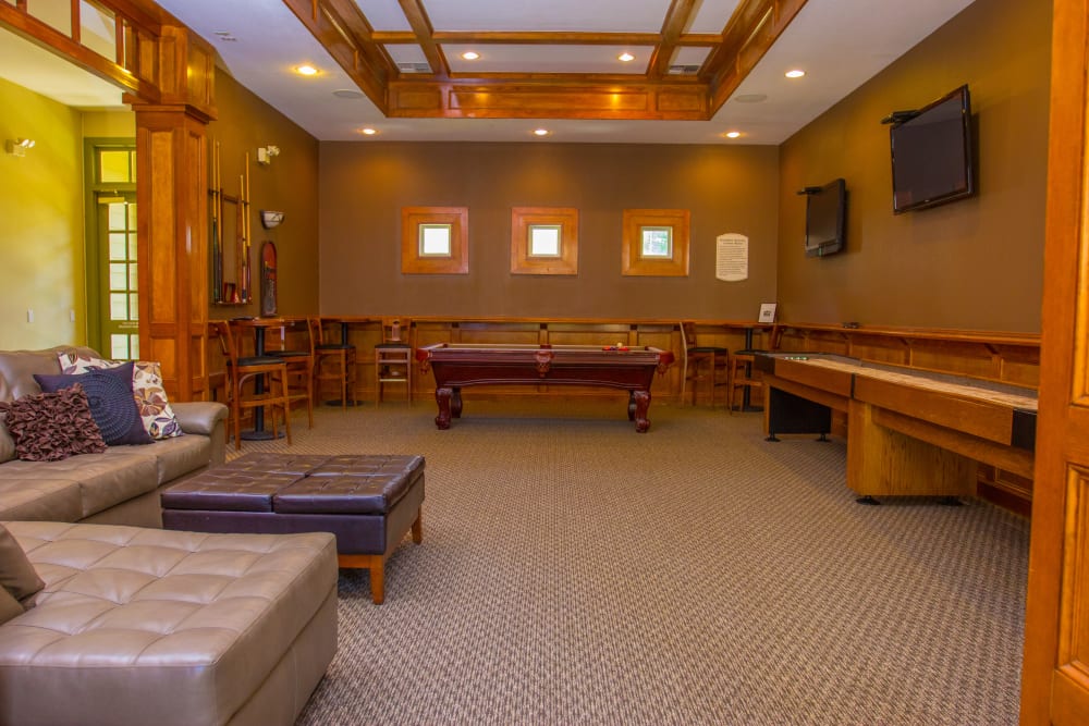 Pool table and shuffleboard in the Clubhouse at The Lodge at River Park in Fort Worth, Texas