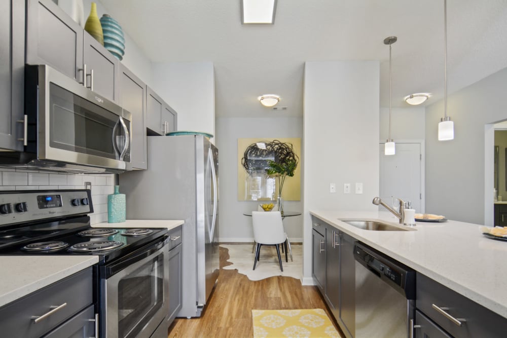 Large open kitchen with quartz countertops in a model home at Ellington Midtown in Atlanta, Georgia
