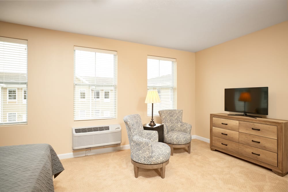 bedroom with dresser and TV