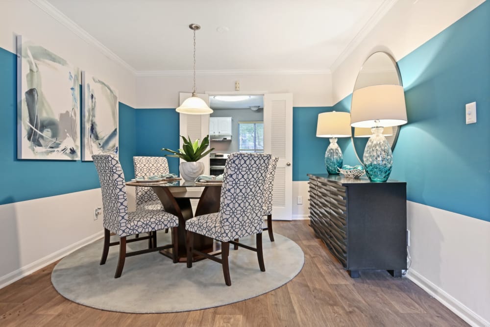 Dining area with custom lighting in a model home at Crest at Riverside in Roswell, Georgia