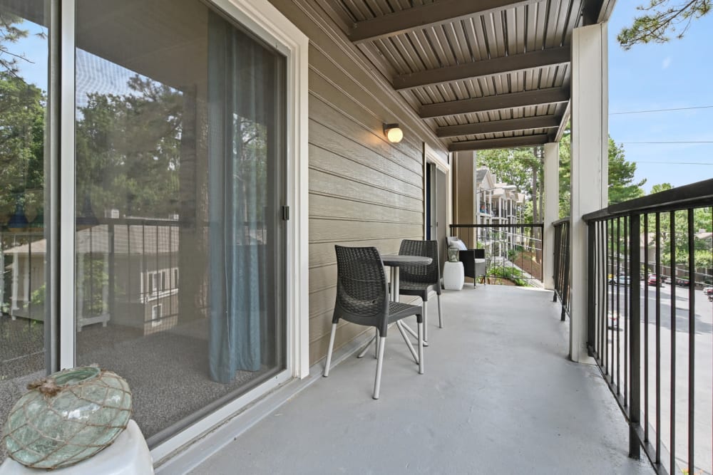 Large private balcony outside a model apartment's primary bedroom at Crest at Riverside in Roswell, Georgia