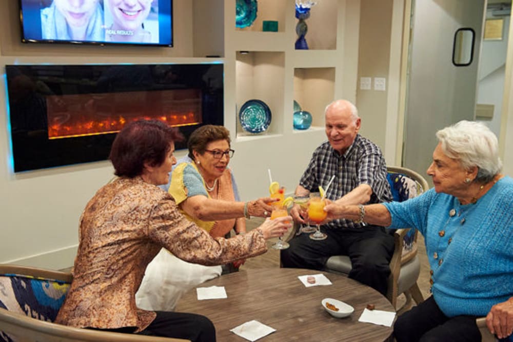 Residents gathered in the onsite lounge for cocktails at Celebration Village Acworth in Acworth, Georgia