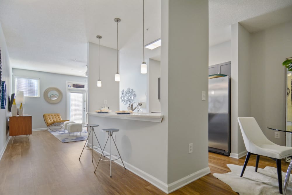 Beautiful open-concept floor plan with high ceilings and hardwood floors in a model home at Ellington Midtown in Atlanta, Georgia